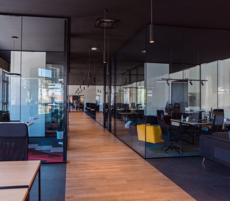In,A,Setting,Of,Modern,,Glass-walled,Business,Startup,Offices,,The